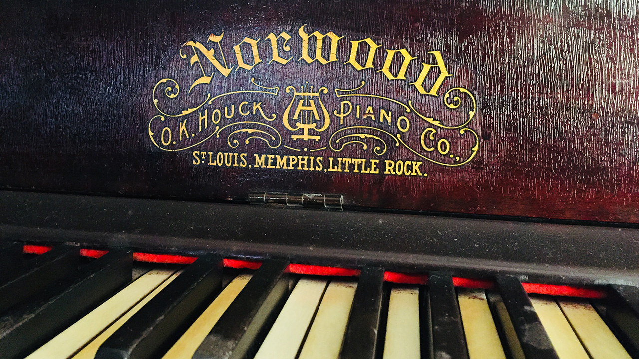 Andrew Doss playing hymns on grandmother's piano